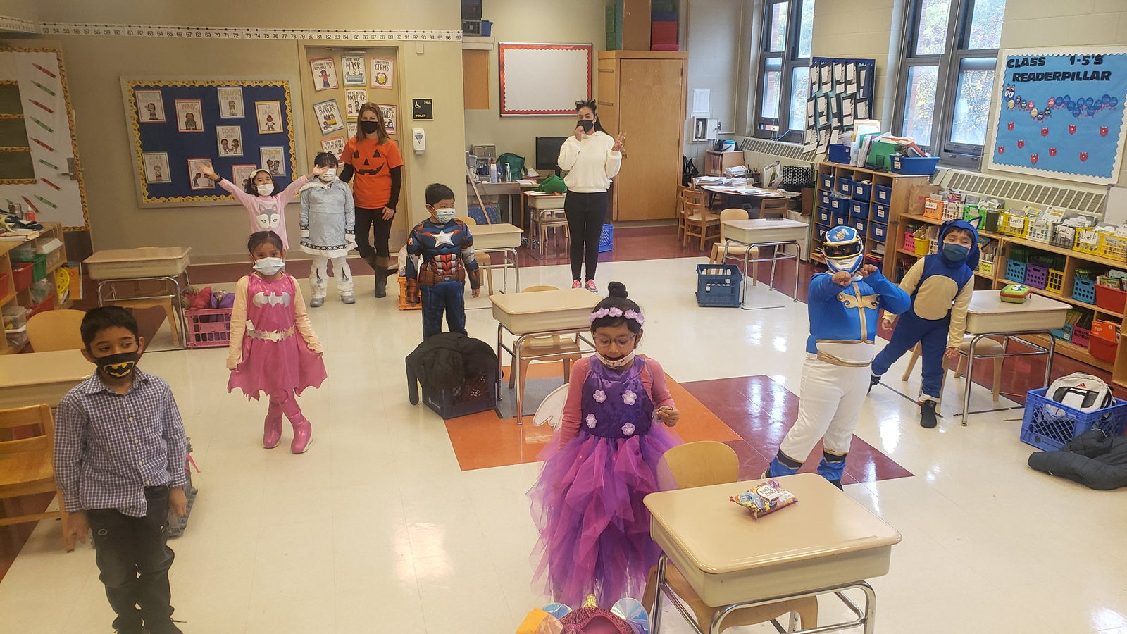 Students in costumes including a princess in their classroom