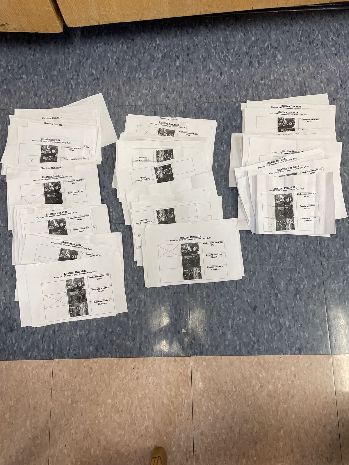 Paper ballots spread out on the floor