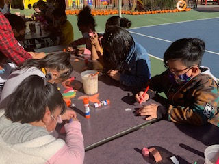 Students working on a craft project at a table