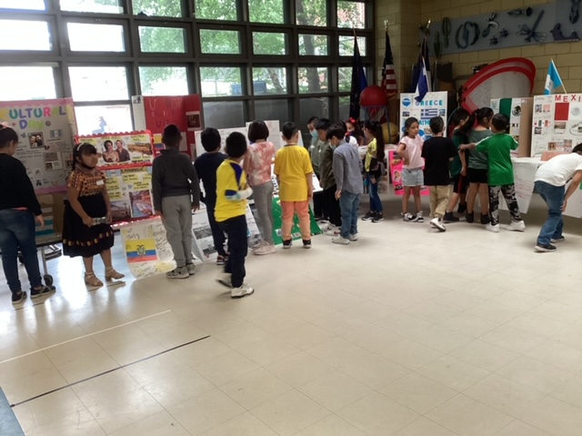 Students walking through the Multicultural Festival displays