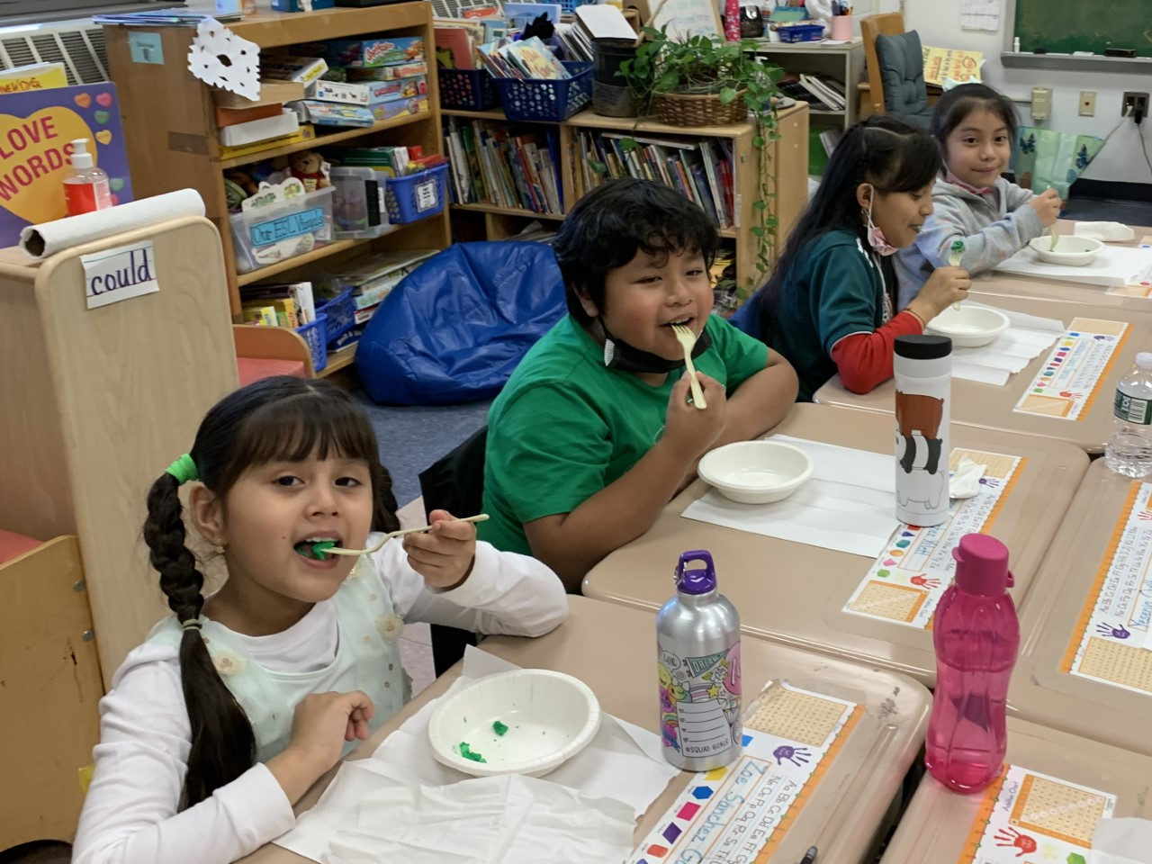 Students tasting green eggs at their desks