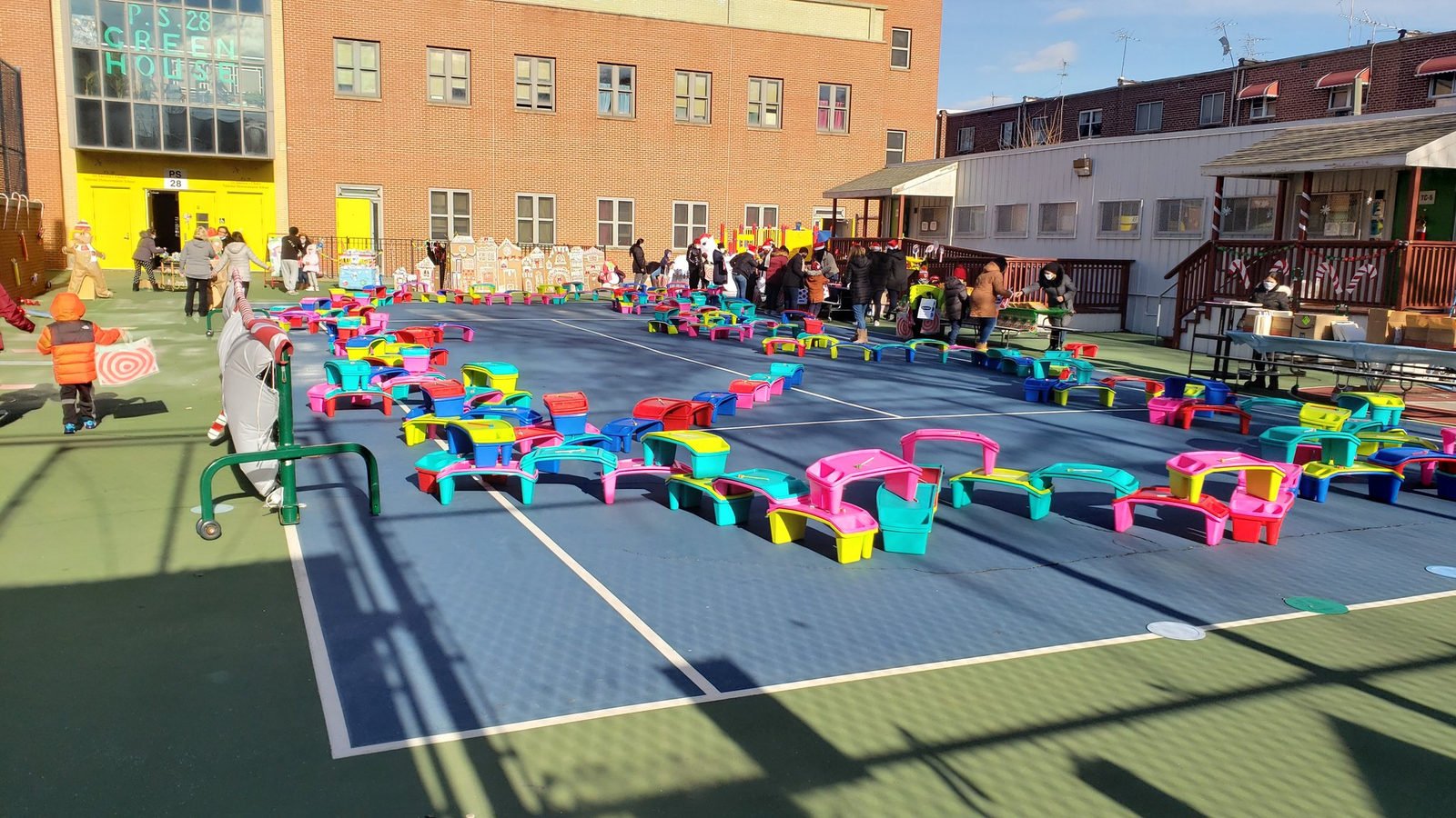 Colorful benches set out across the schoolyard for Gingerbread Lane