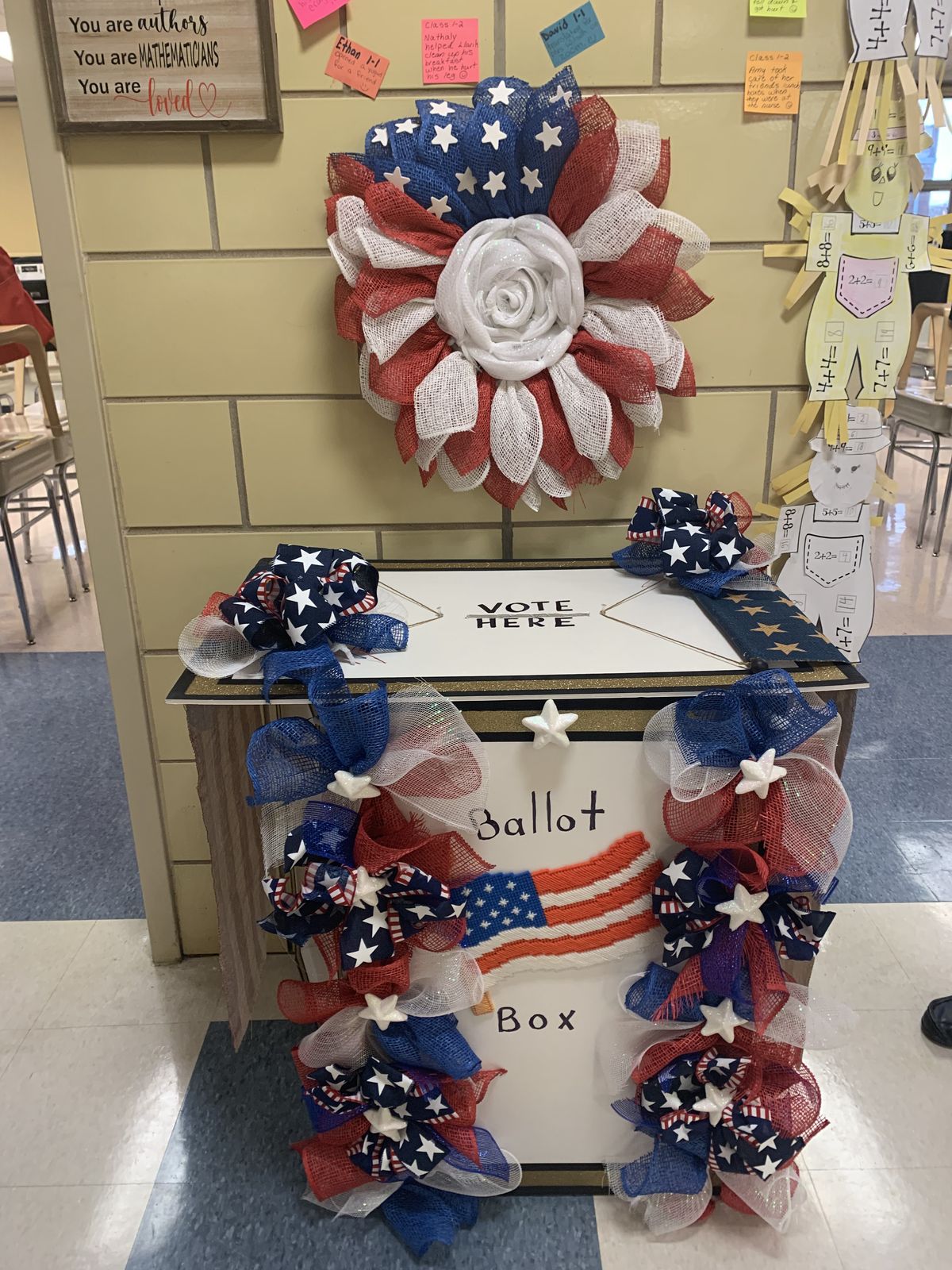 Decorated ballot box with a red, white and blue wreath