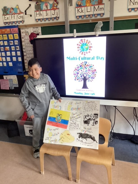 Student presenting a poster with the Ecuador flag