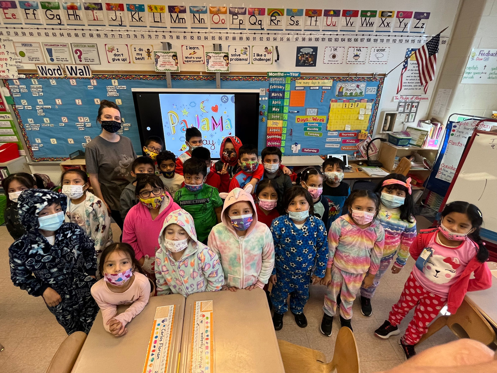 Class in pajamas posing for a photo in the classroom