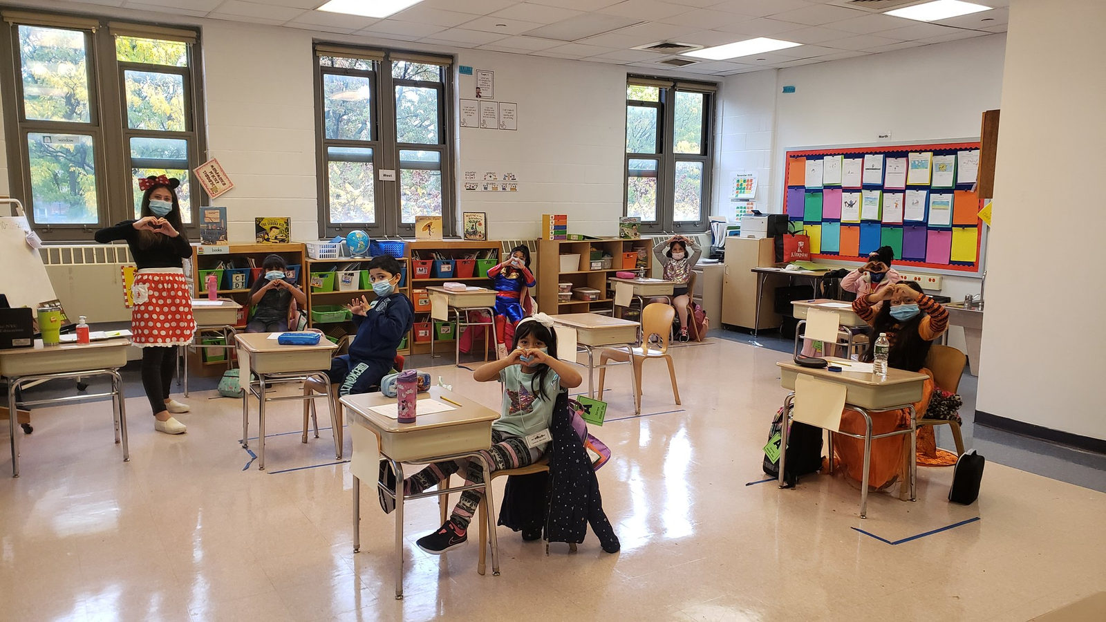 Students in costumes seated around the classroom