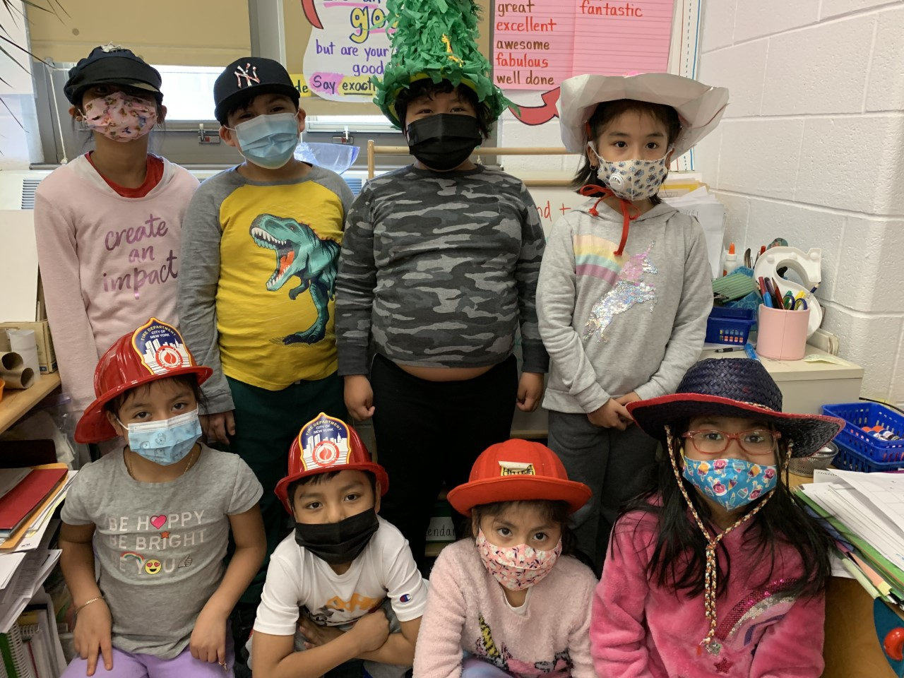 Students in fun hats posing together