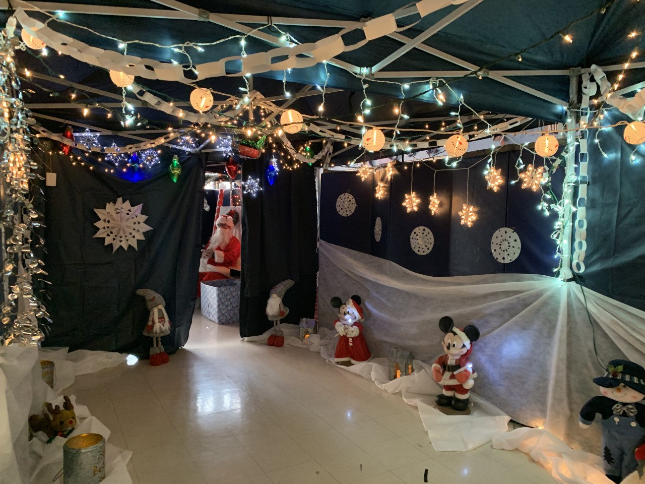 Tent decorated with lights, snowflakes and snowmen for the winter event
