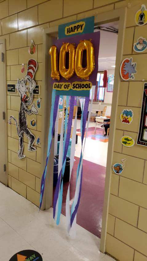 Classroom door decorated for the 100th day of school
