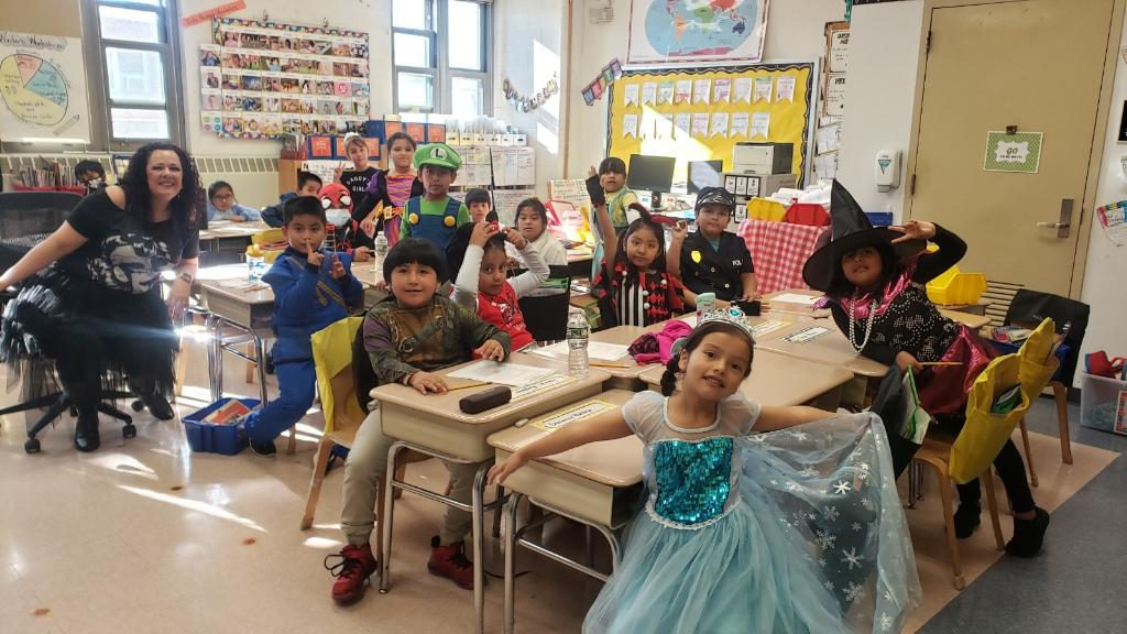 Student in a princess dress with classmates in costumes
