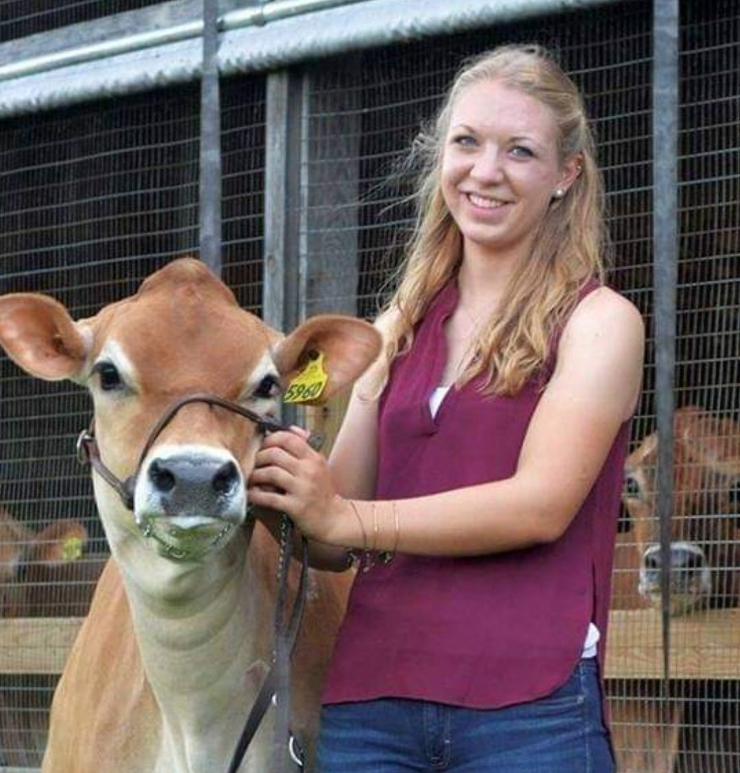 Farmer Emily smiles beside Penny