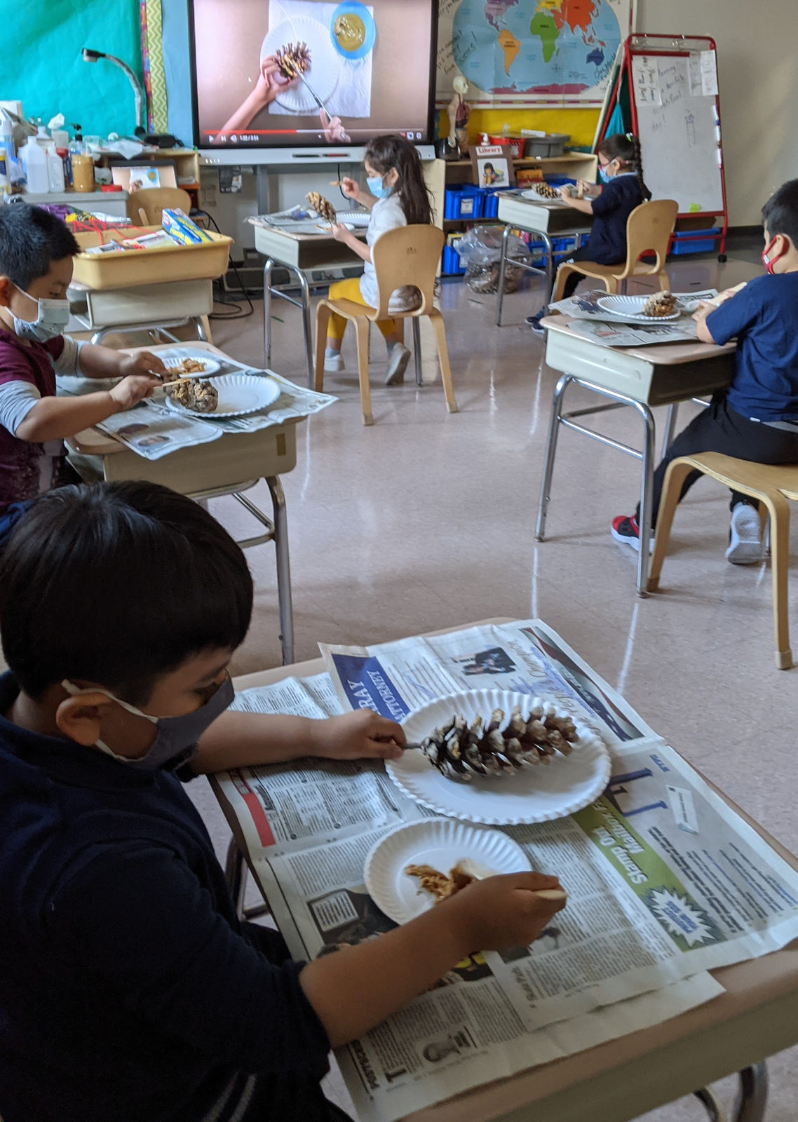 Students making bird feeders