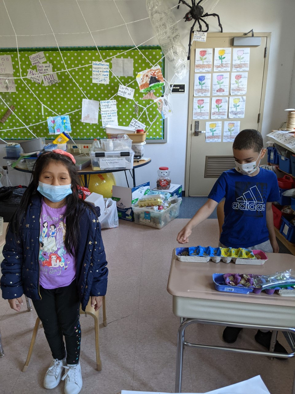 Students building egg-carton Mancala boards