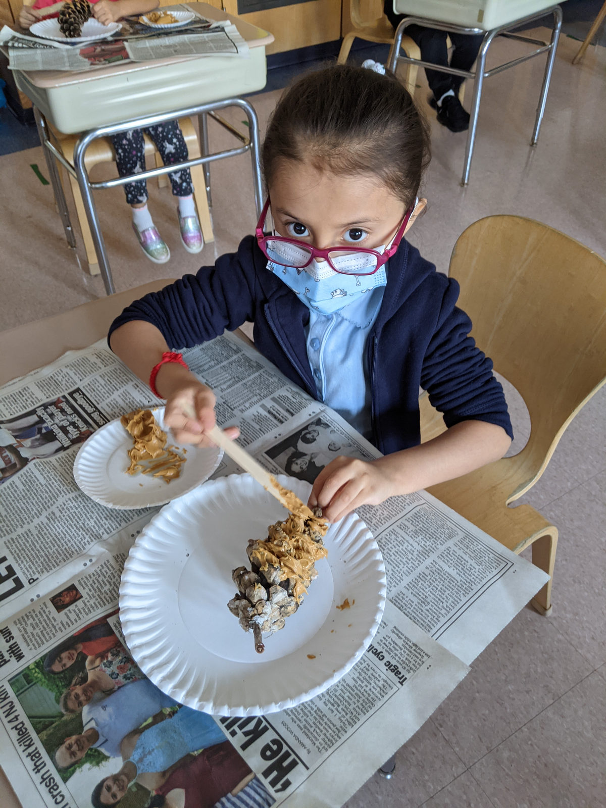 Student making bird feeder