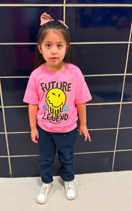 Student ambassador in a pink Future Legend shirt