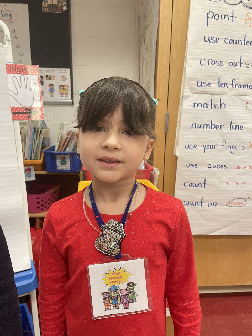 A student wearing a Kind Words Hero badge