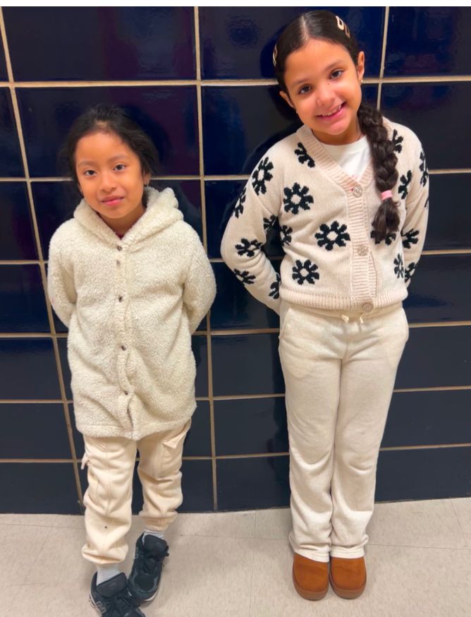 Two student ambassadors in white outfits