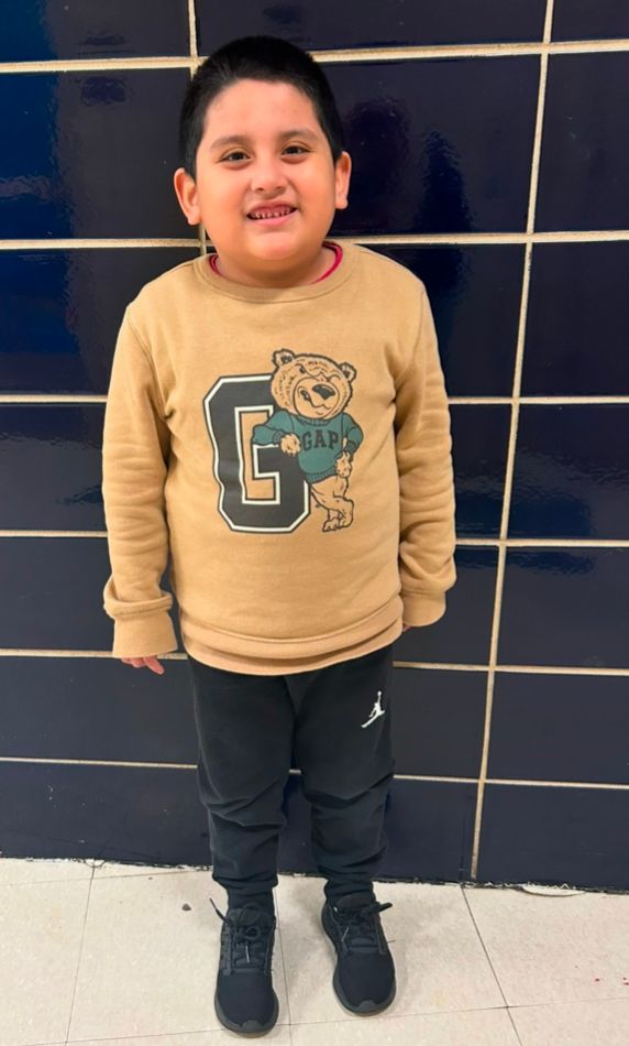 Student ambassador in a tan bear sweatshirt