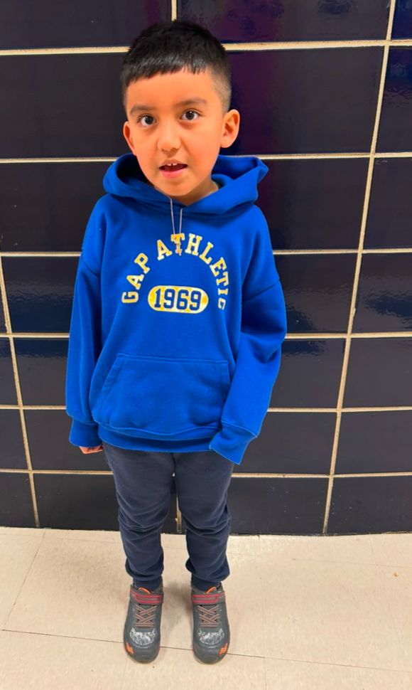 Student ambassador in a blue hooded sweatshirt