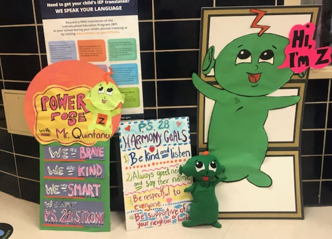 SEL bulletin board with the Sanford Harmony character Z saying Hi I'm Z, a Power Pose poster and the P.S. 28 Harmony Goals