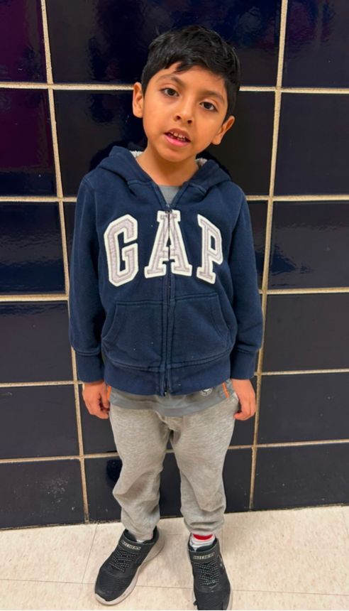 Student ambassador in a navy hooded sweatshirt